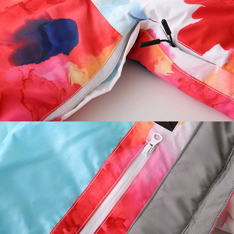 Close-up of colorful stylish female waterproof jacket with zippers designed for skiing and snowboarding, showcasing vibrant fabric pattern.